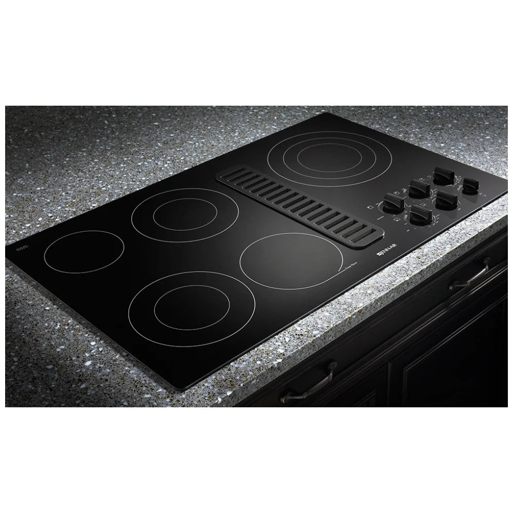 Jenn-Air JED3536WS 36-inch electric cooktop with stainless steel finish and built-in downdraft ventilation system.